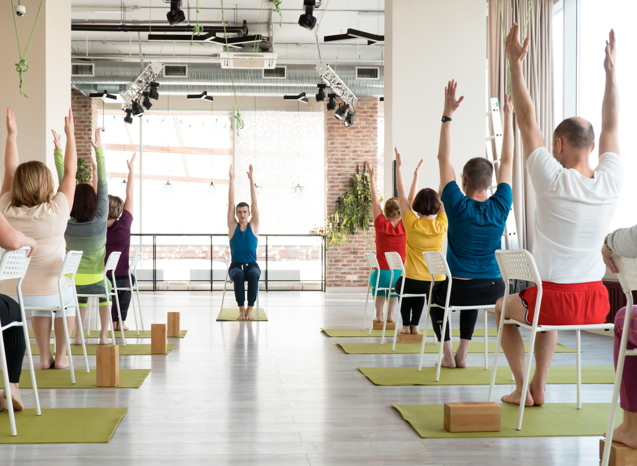Group of people doing chair yoga